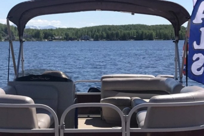 a chair sitting in front of a body of water